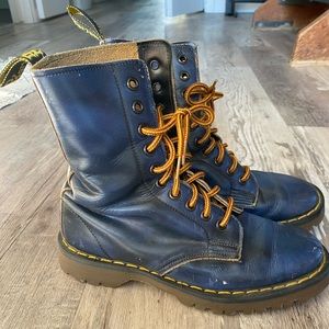 Blue Dr. Marten combat boots.